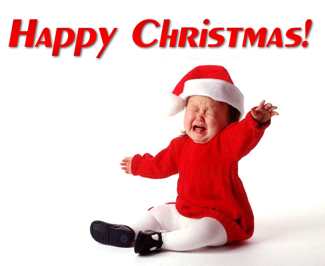 A little girl crying desperately in Santa's dress. With text: Happy Christmas