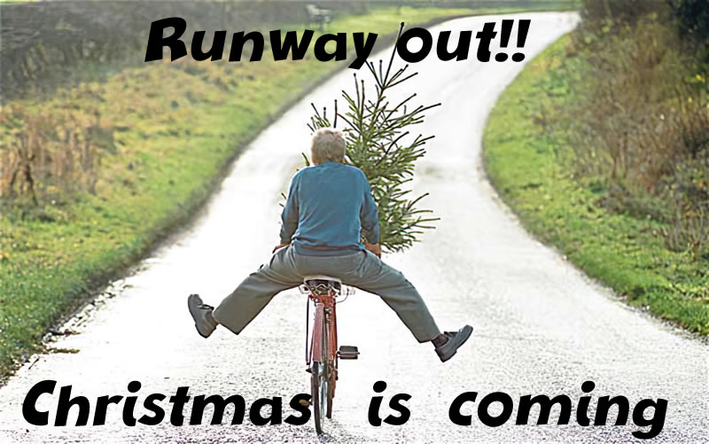 Funny image with the man on a bicycle carrying a Christmas tree with his legs spread out. Runway out!! !! Christmas is coming!