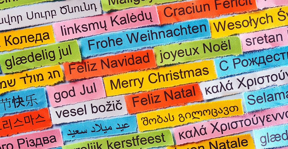 Image with many colored cards with the inscription Merry Christmas in the different European languages, for international greetings